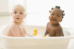 Two babies in a tub