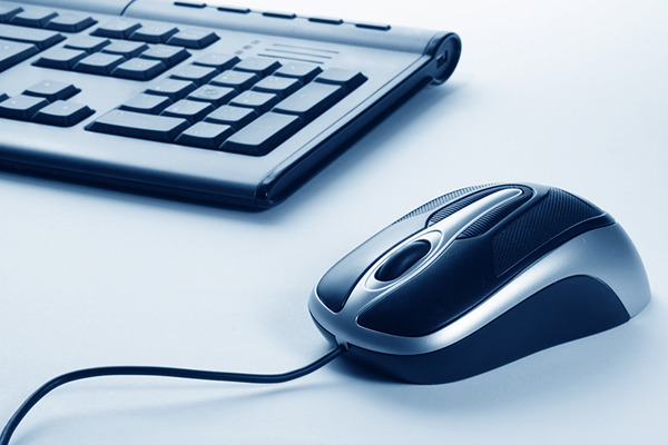 a laptop with a magnifying glass on its keyboard