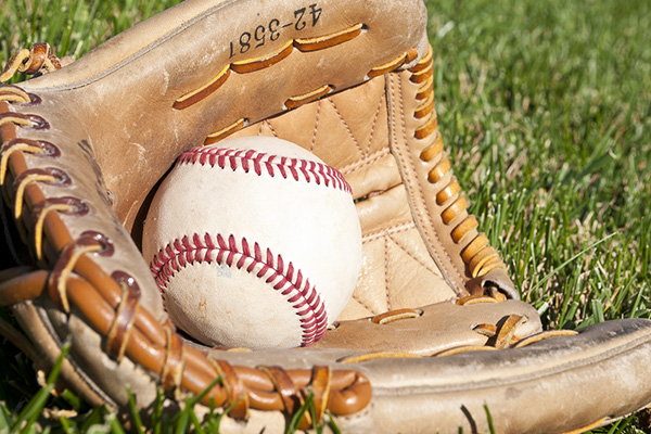 a baseball resting in a mitt