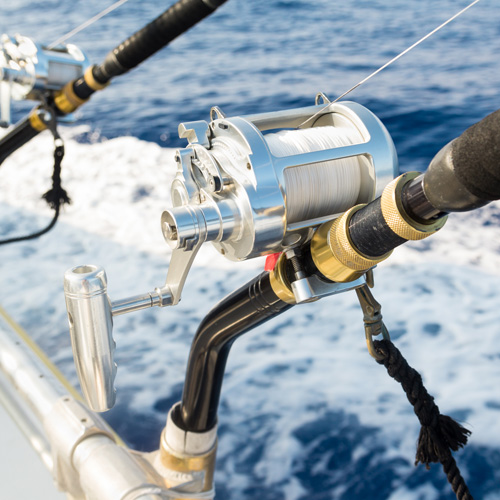 a fishing reel on a boat in the ocean
