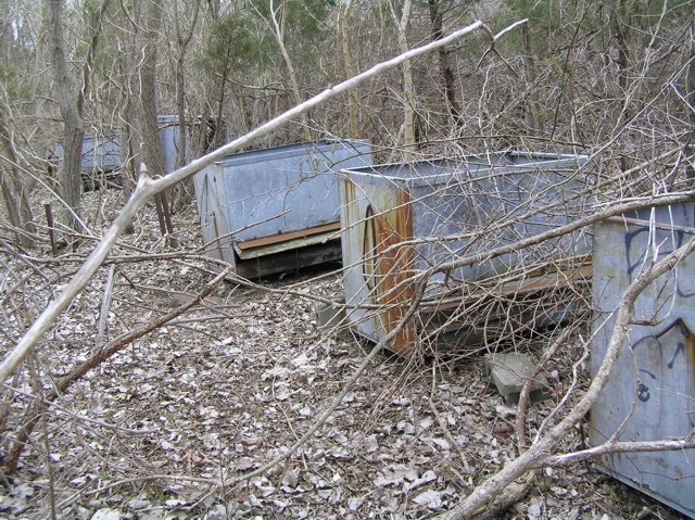 image 21 - gray metal containers in the middle of the forest