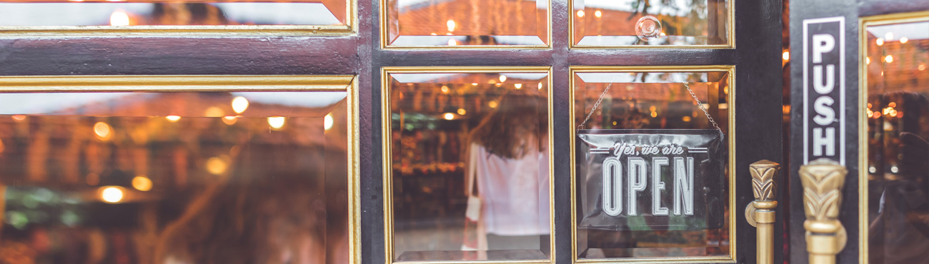 woman standing in front of restaurant