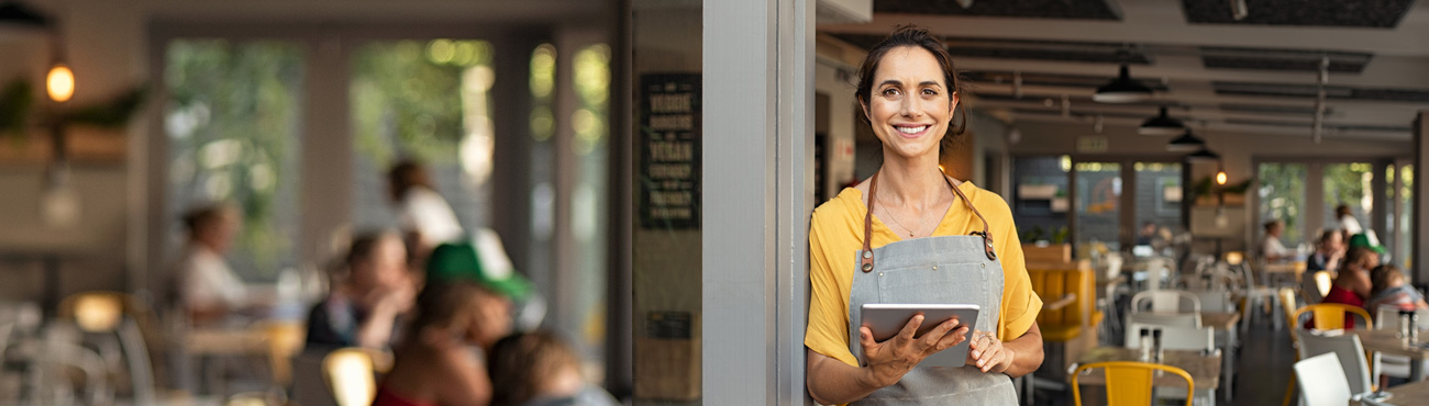 woman standing in front of restaurant