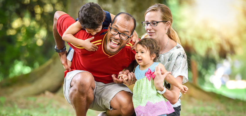 family playing at a park