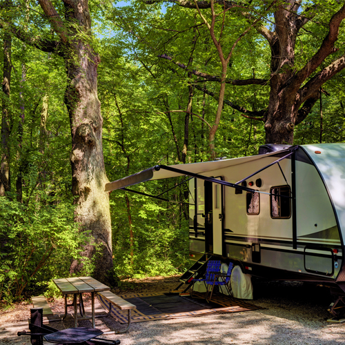 an rv set up at a campsite