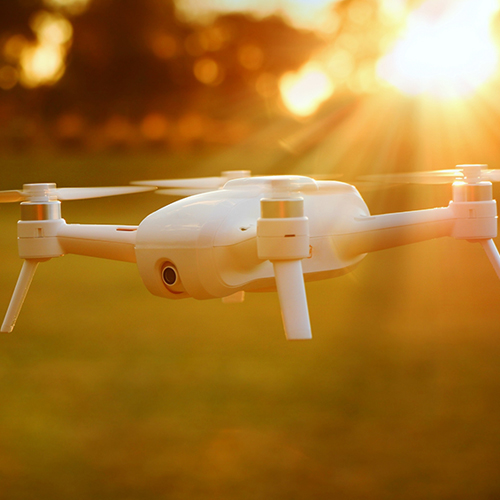 a drone flying over a field