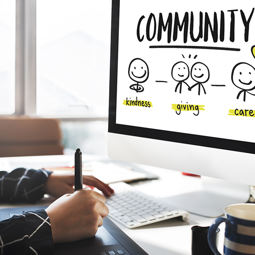 a person at a computer viewing a message about giving back to the community