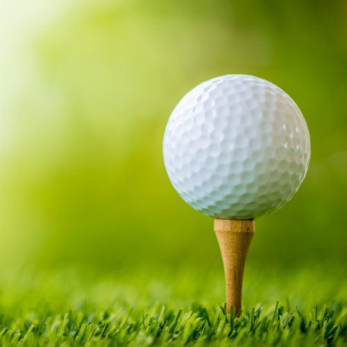 a golf ball on top of a tee