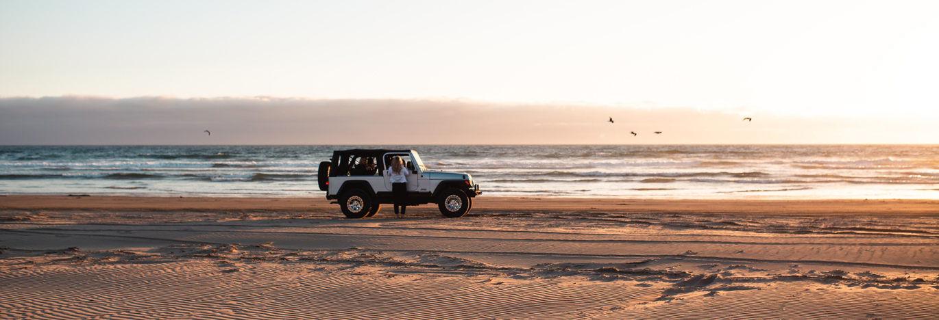 a jeep on a beach